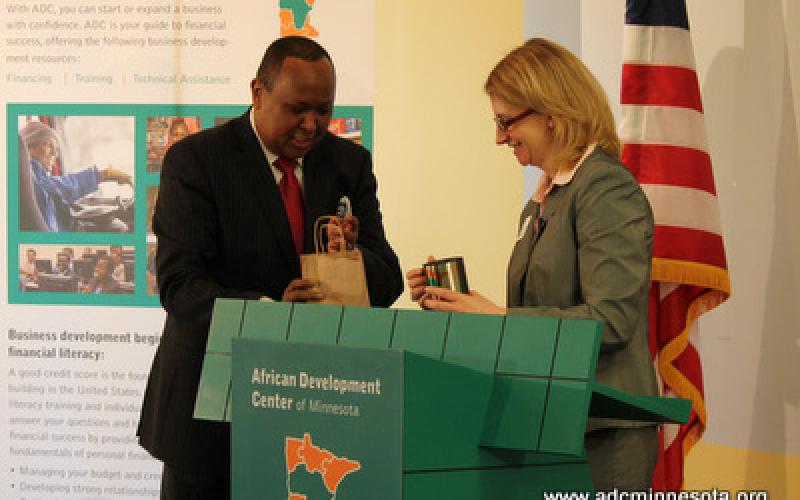 Hussein Samatar gives Adriana Abariotes with a token of appreciation