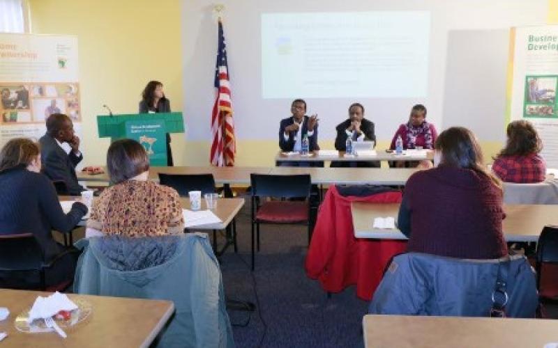 Community leaders Sandol Khalaf, Mohamed Mohamud, and Buko Oriola address small gathering