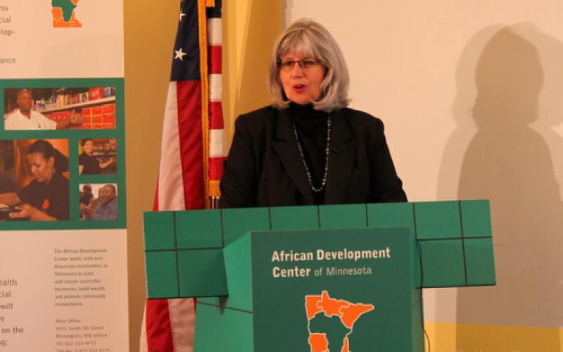 Jo-Anne Stately of the Minneapolis Foundation speaks to the group from a podium