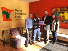 Chamber of Commerce recognizes ADC's 5-year support of business development in their city Regional ADC manager Abdirahin Hussen poses with members of Wilmar Chamber of Commerce